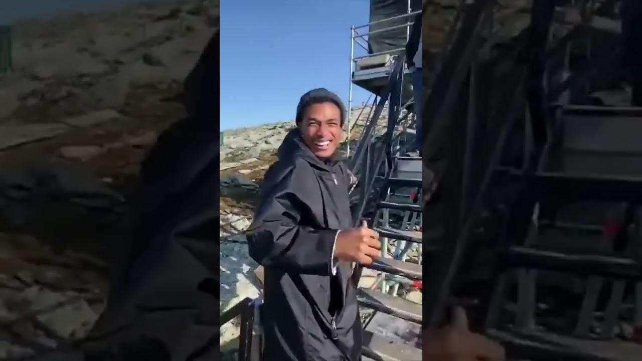 Watch the cast react to Tom Cruise riding a motorbike off a cliff.