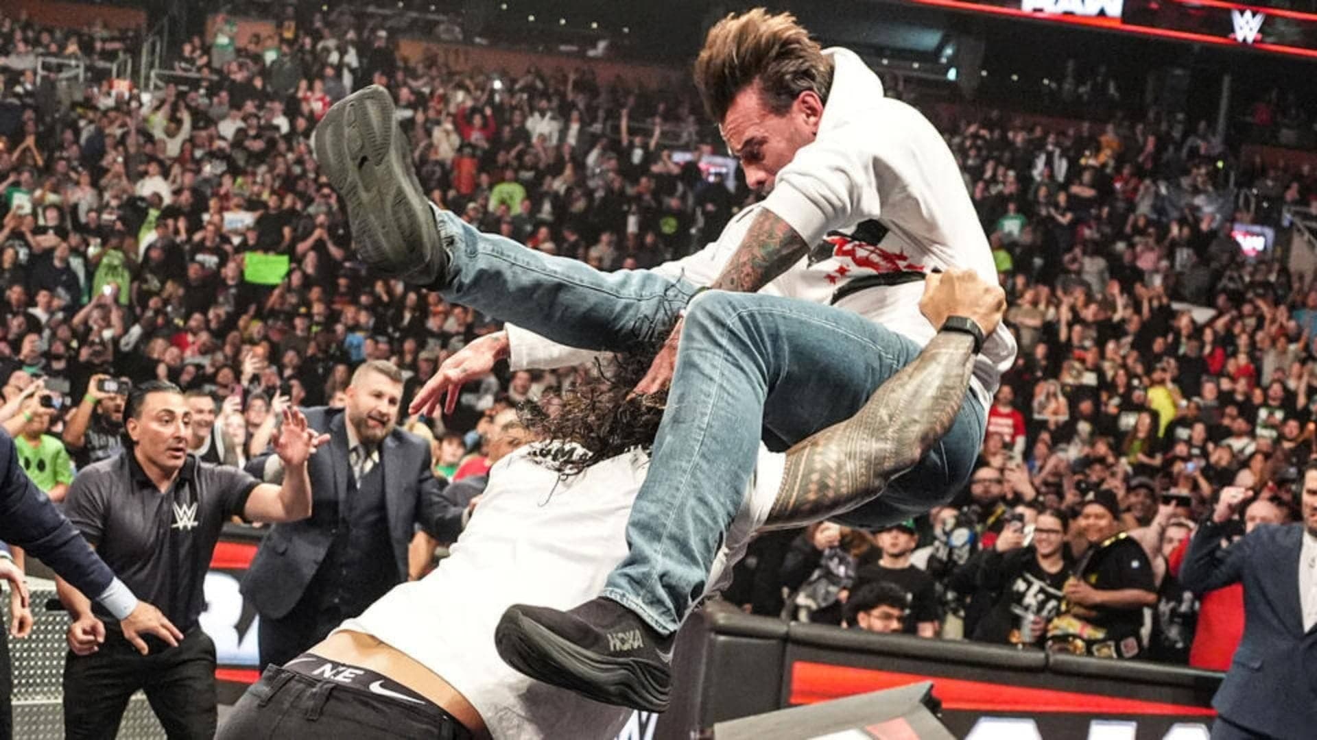 Roman Reigns Obliterates CM Punk Through Table on WWE RAW
